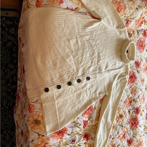 Cream Turtleneck Sweater with Black Buttons